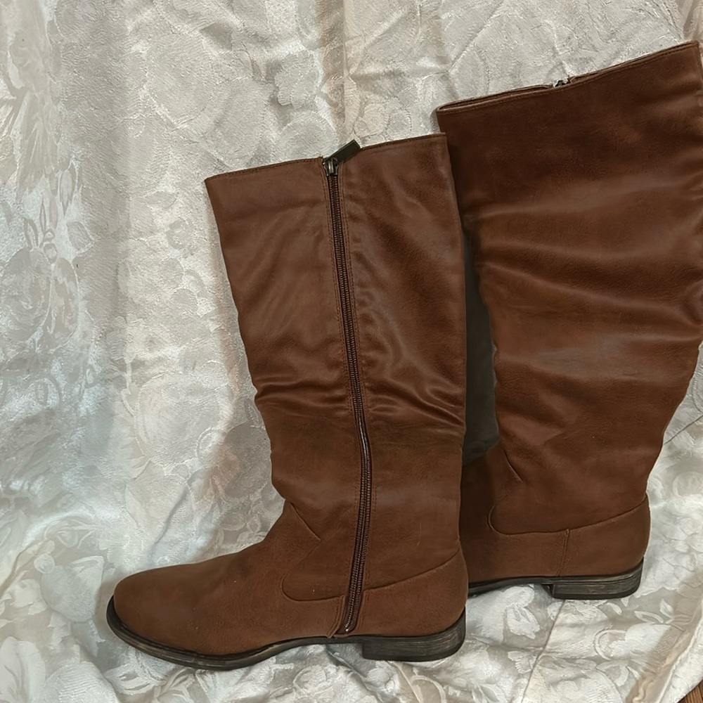 Brand new in box. High brown zip up boots size 6